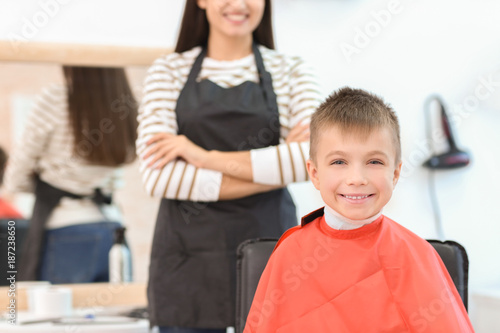 Cute little boy in hairdres...
