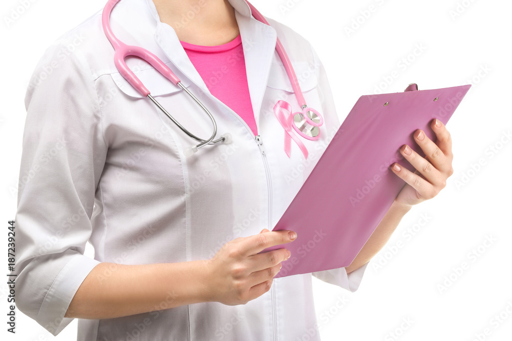 Doctor with pink ribbon on robe and clipboard against white background. Breast cancer awareness concept Doctor with pink ribbon on robe and clipboard against white background. Breast cancer awareness concept