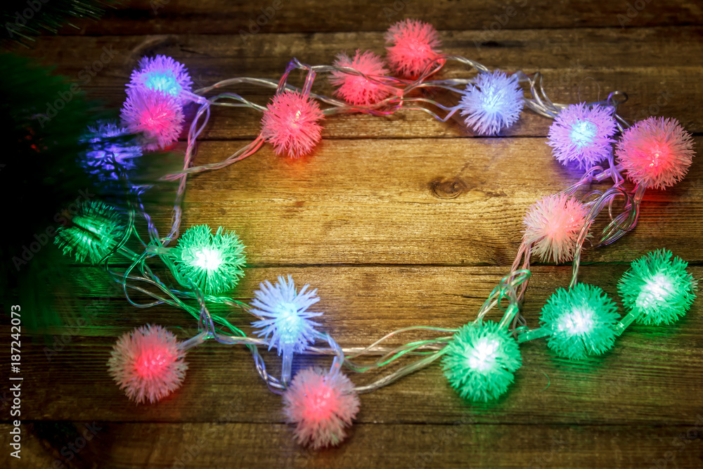 Obraz premium Christmas background with garlands on the table