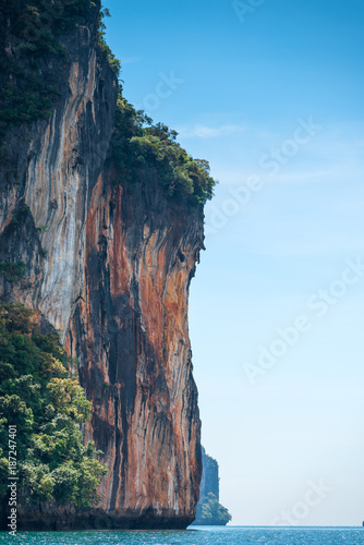 vertical landscape - view of a high steep cliff in the sea in Krabi, Thailand