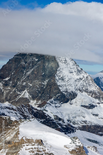 Winter panorama of mount Matterhorn covered with clouds, Canton of Valais, Alps, Switzerland 