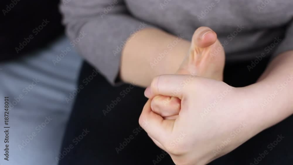 Close-up of wringing nervous woman hands. Close-up of wringing nervous woman hands.