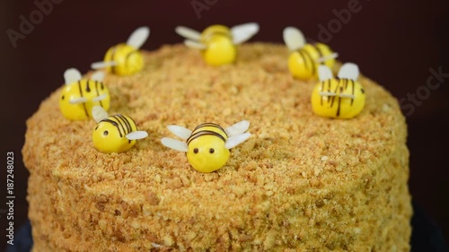 Girl decorating honey cake bees photo