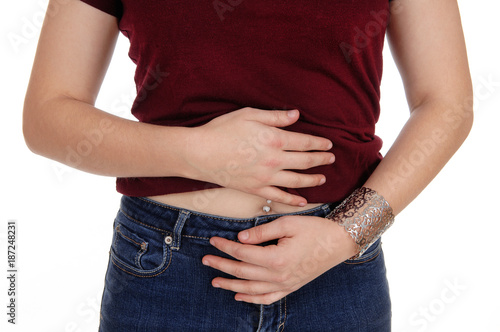 Closeup of a woman's stomach with pain