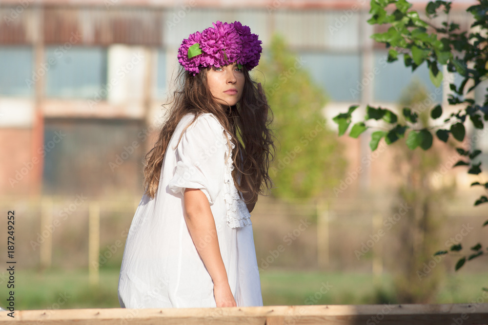 Naklejka premium hipster girl with flower wreath on head 