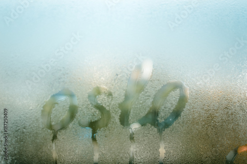 Photography Oslo capital of Norway sign written on fogged rainy glass natural condensated ou