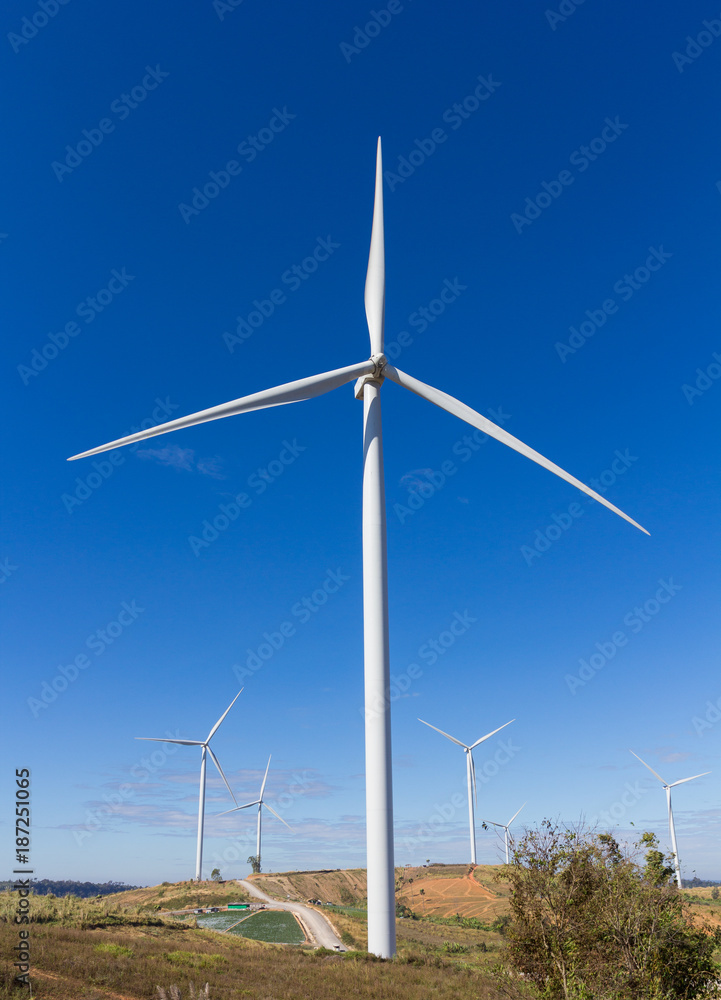 Wind turbines on hill top.