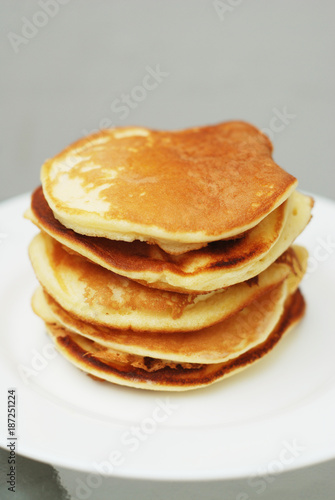 A Stack of Sweet Pancakes on a White Background. Breakfast.