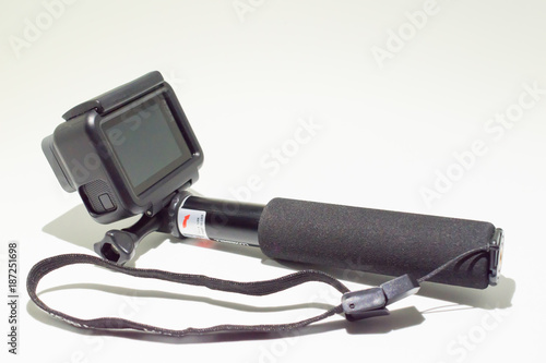 Toledo, Spain - January 6, 2.018: GoPro Hero 6 Black Edition on a selfie stick isolated on white background. Action camera