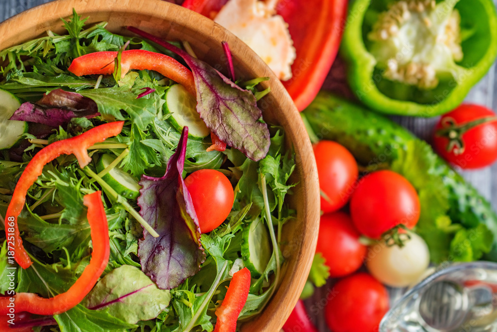 Fresh rustic vegetable salad on rustic background Fresh rustic vegetable salad on rustic background