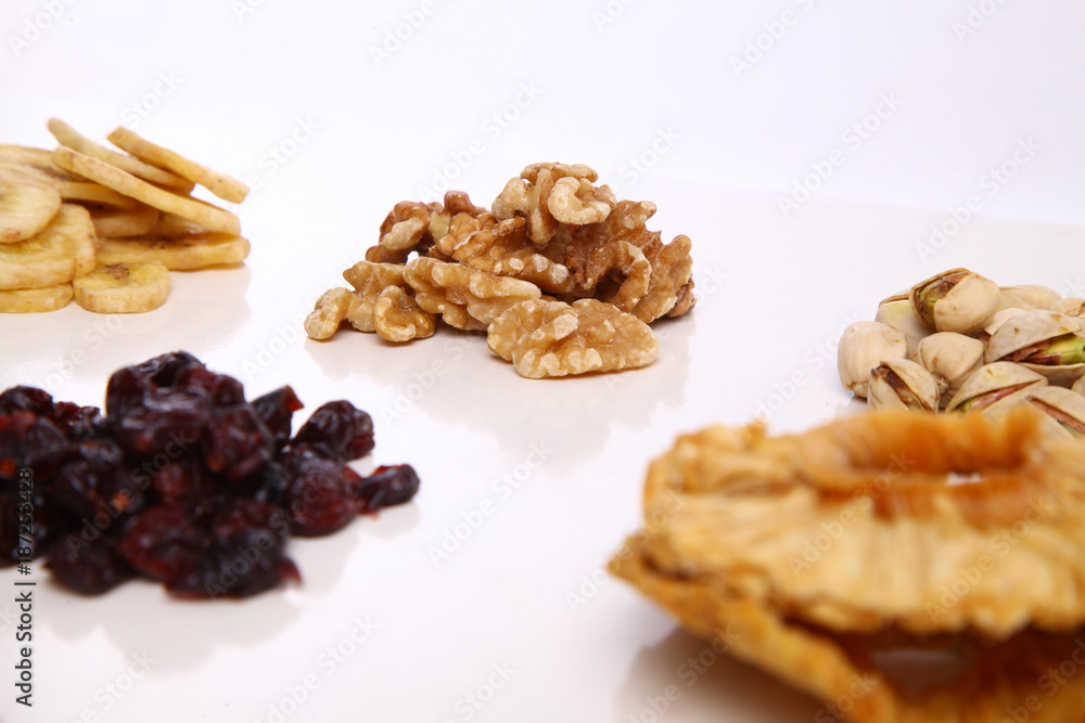 Fototapeta premium piles of Mixed dried fruits and nuts - symbols of jewish holiday Tu Bishvat