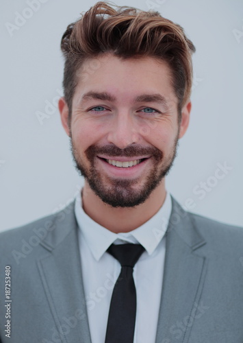 Portrait of a smiling handsome business man  over white backgrou