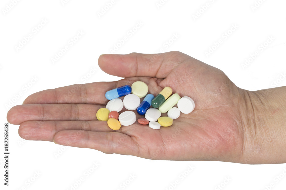 Senior woman holding assorted capsules in her hands. Conceptual of health care for the elderly. Senior woman holding assorted capsules in her hands. Conceptual of health care for the elderly.
