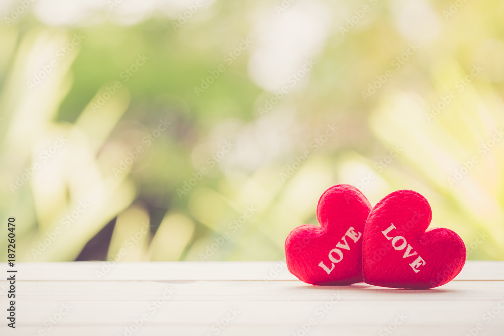 Red heart on wood table top with nature blur bokeh background, valentines day concept. Red heart on wood table top with nature blur bokeh background, valentines day concept.