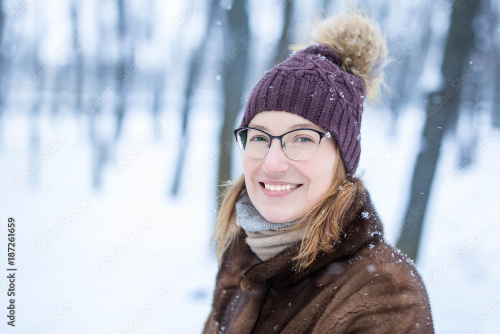 Portrait of young woman   during walk  at winter