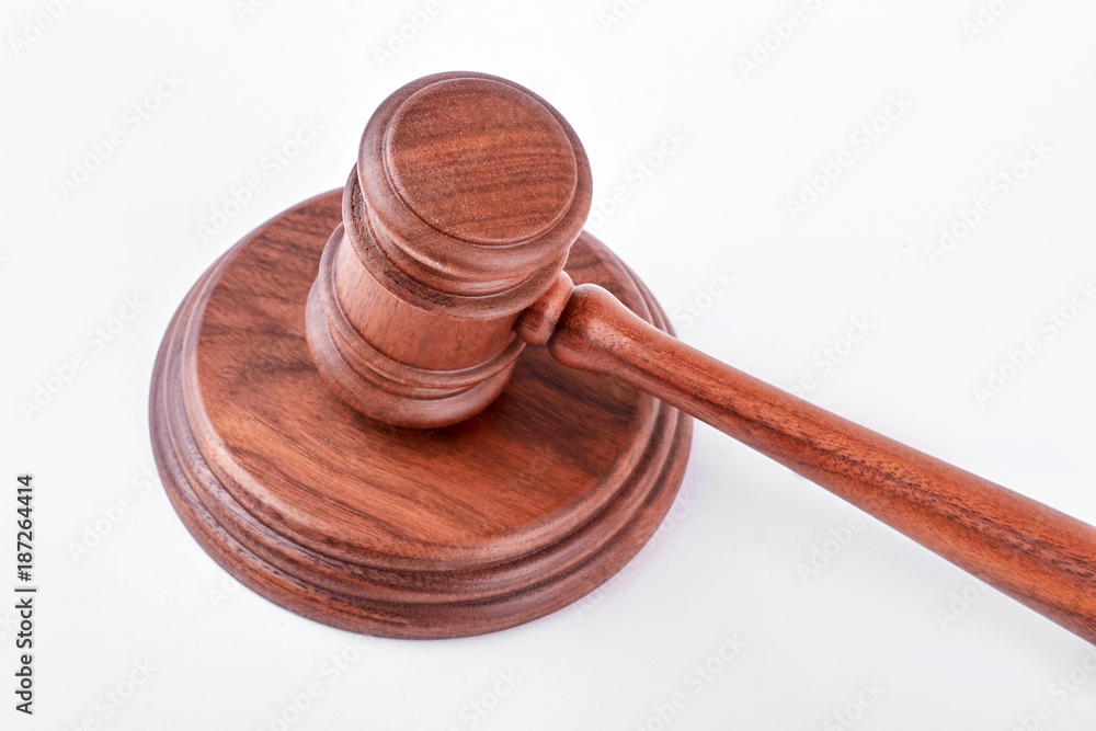 Wooden gavel and stand. Judge gavel and stand over white background. Law, business, auction.