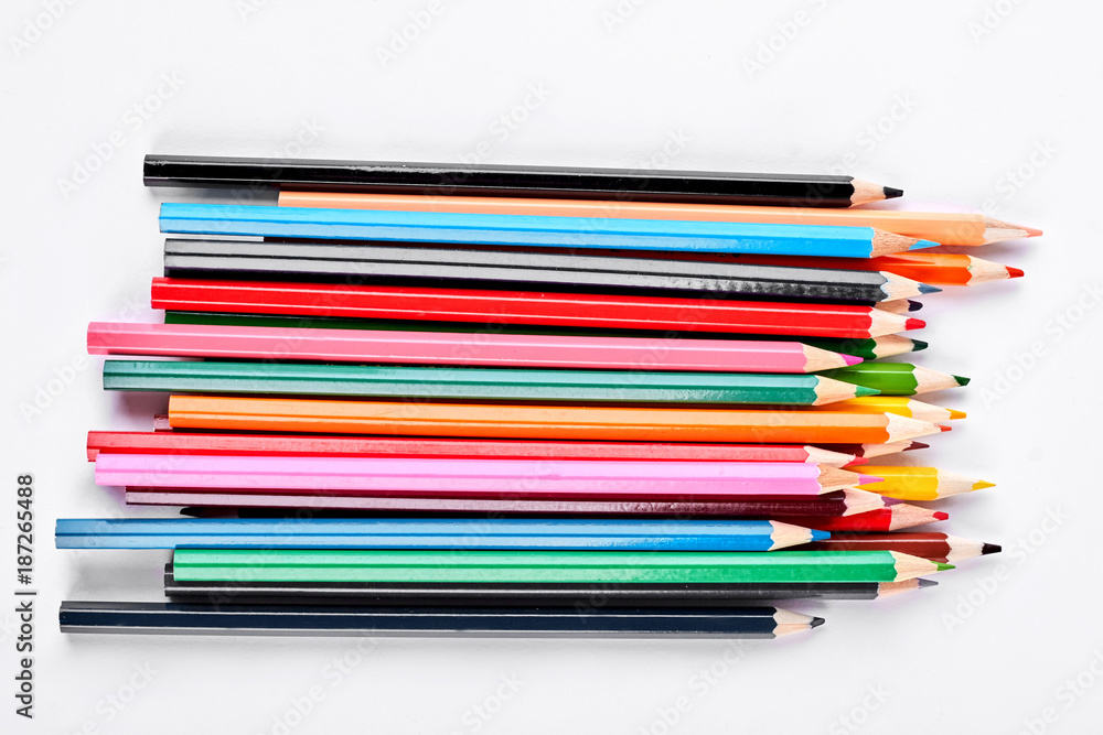 Group of multicolored pencils on white background. Heap of pencils of different colors, white background. Group of multicolored pencils on white background. Heap of pencils of different colors, white background.