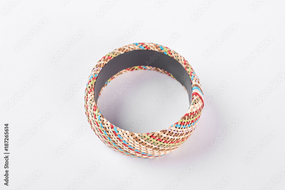 Woman luxury handmade bracelet, top view. Female stylish bangle isolated on white background. Woman fashion accessory on hand. Woman luxury handmade bracelet, top view. Female stylish bangle isolated on white background. Woman fashion accessory on hand.