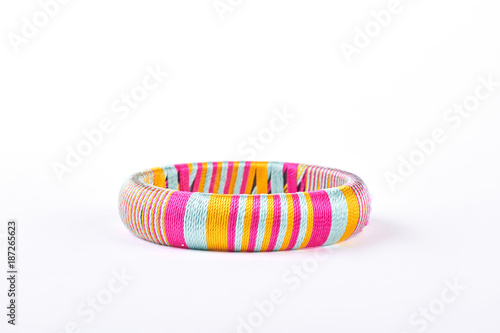 Beautiful colorful bracelet on white background. Bright striped bracelet isolated on white background. Woman modern accessory.