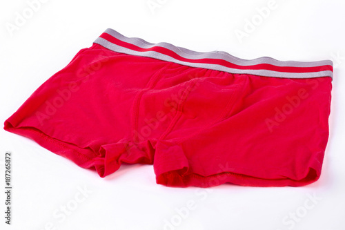 Male pants isolated on white background. Red cotton boxer pants for boy on white background. Men underwear of high quality.