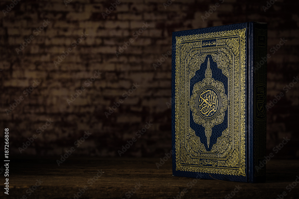 Koran - holy book of Muslims ( public item of all muslims ) on the table , still life