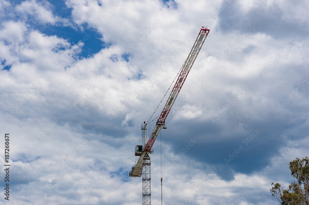 Hoisting crane against sky on the background Hoisting crane against sky on the background