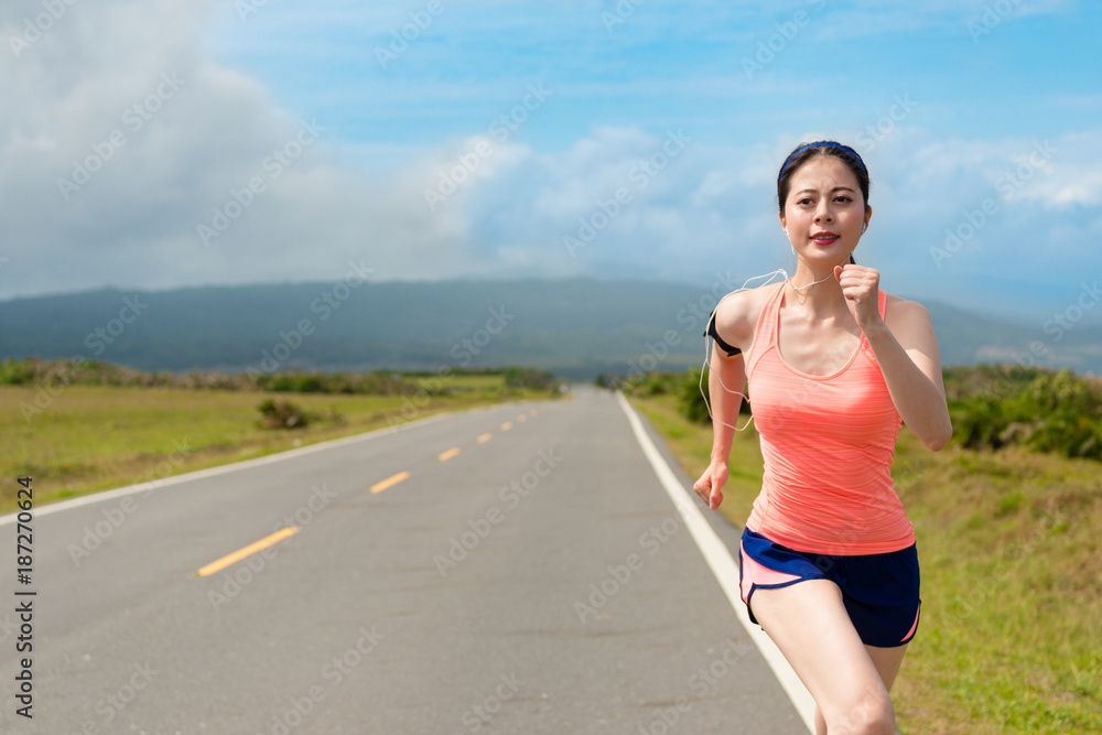 happy beautiful woman jogger running on road happy beautiful woman jogger running on road