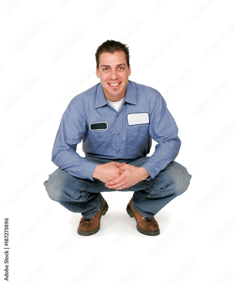 An adult male blue collar worker isolated on white. An adult male blue collar worker isolated on white.