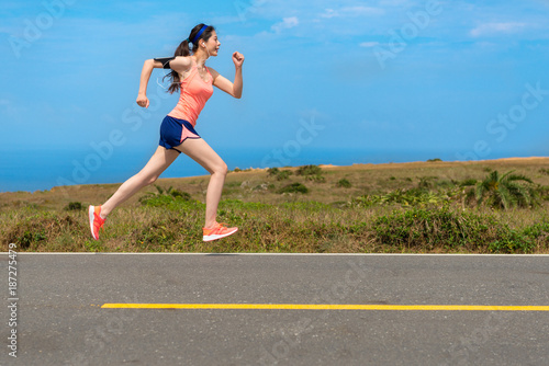 side view photo of professional female runner