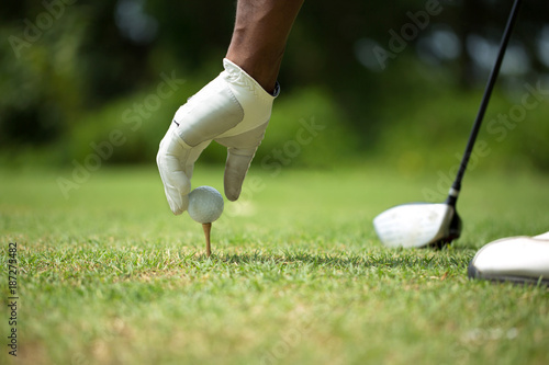 African American man playing golf.