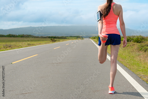 back view photo of beautiful young female runner