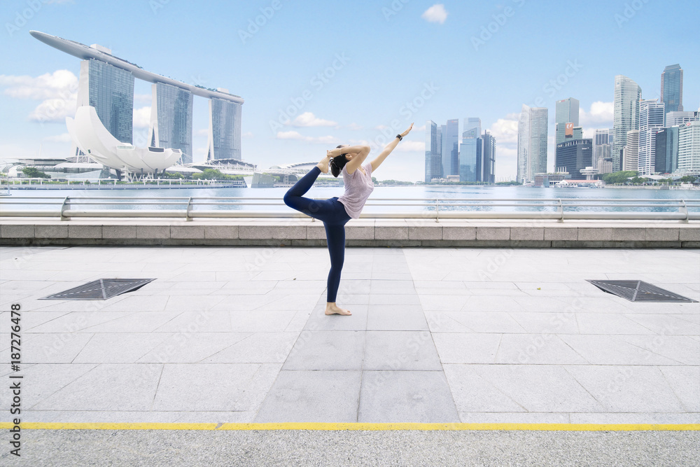 Young woman exercising yoga at outdoor Young woman exercising yoga at outdoor