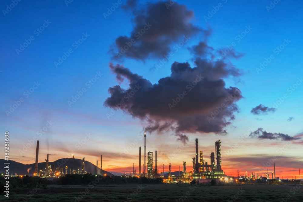 Oil refinery at sunrise sky.