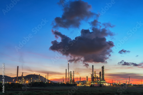 Oil refinery at sunrise sky.