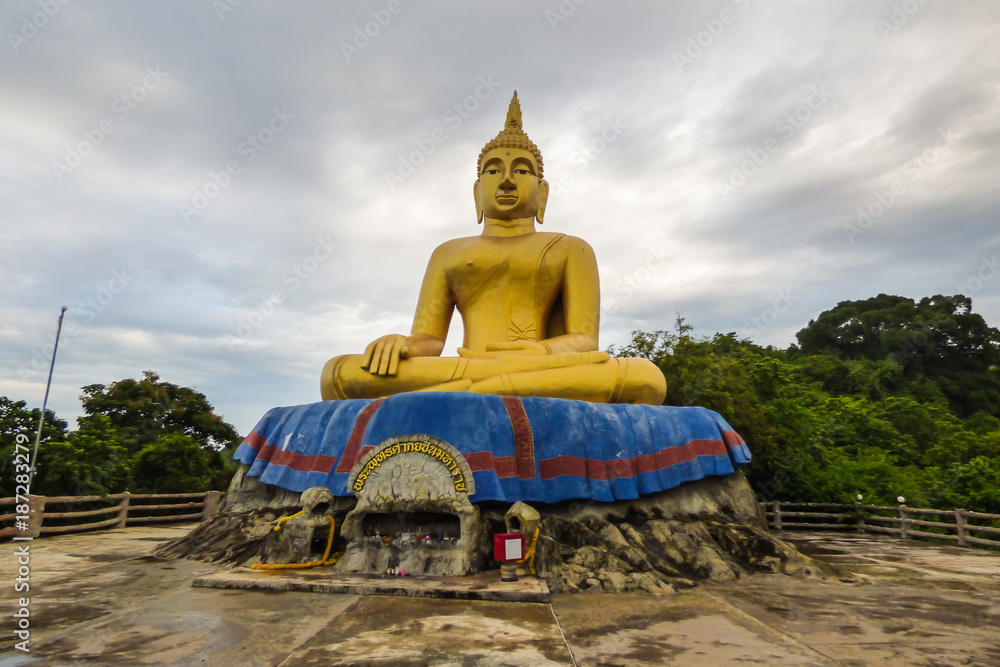 Hua Hin, Thailand - Circa October 2017: Golden sitting Buddha statue on Khao Tao (Turtle mountain) Hua Hin, Thailand - Circa October 2017: Golden sitting Buddha statue on Khao Tao (Turtle mountain)