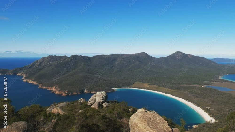 panning shot of wineglass bay from mt amos in freycinet national park on the east coast of tasmania, australia panning shot of wineglass bay from mt amos in freycinet national park on the east coast of tasmania, australia