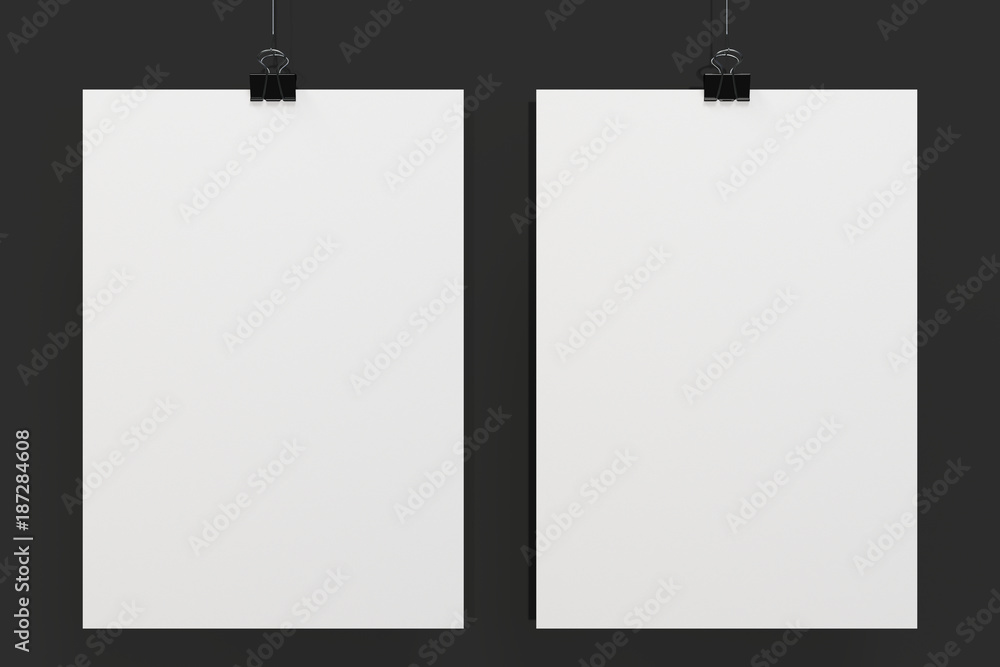 Two blank white posters with binder clip mockup on black background Two blank white posters with binder clip mockup on black background