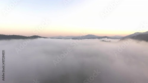 Wallpaper Mural aerial shot : cloud surfing in mountain range sunrise background Torontodigital.ca