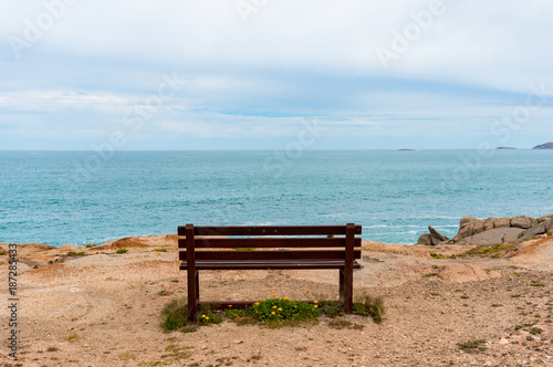 Empty bench with picturesque view towards the open ocean, sea