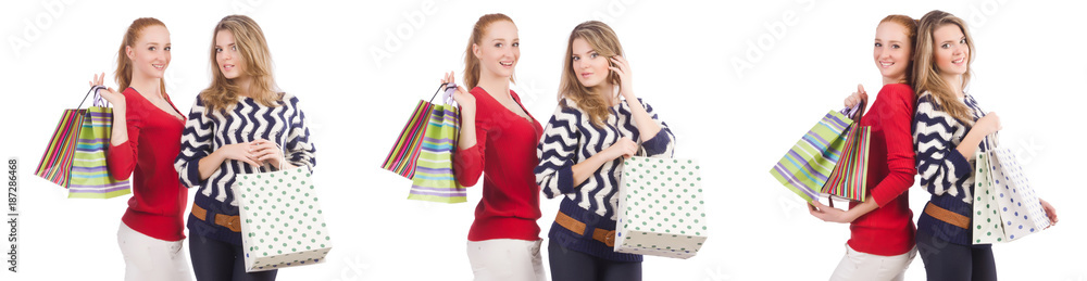 Friends with shopping bags isolated on white Friends with shopping bags isolated on white