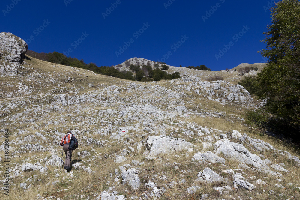 hiker on mountain trail matese gallinola miletto
