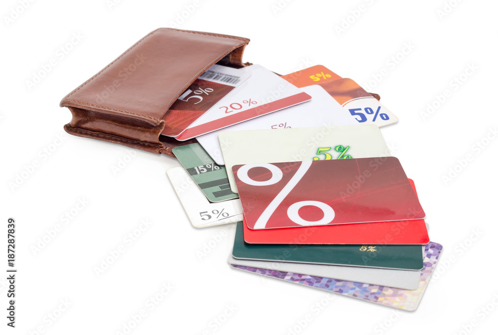 Discount cards in brown leather wallet on a white background Discount cards in brown leather wallet on a white background