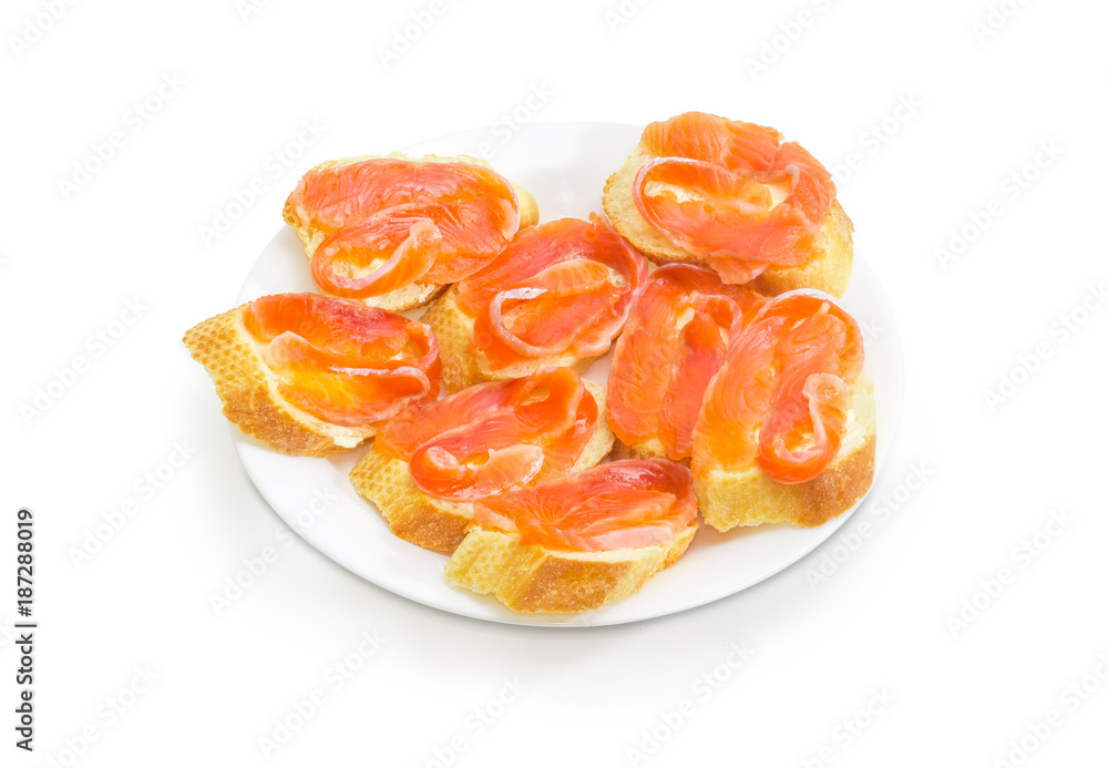 Sandwiches made with baguette, butter and salted salmon on dish
