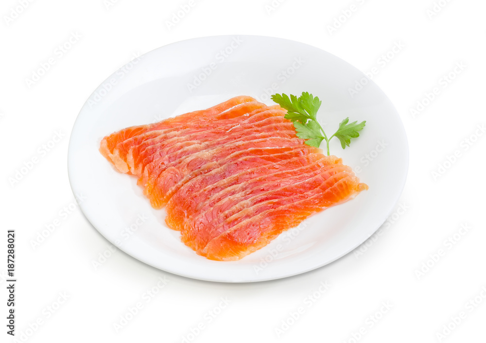 Sliced salted fillet of salmon on a white dish Sliced salted fillet of salmon on a white dish