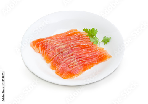 Sliced salted fillet of salmon on a white dish