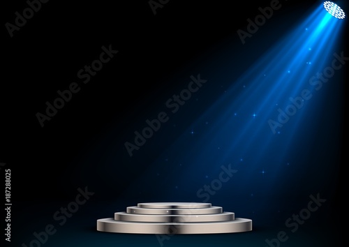 Round white podium and spotlights on dark background
