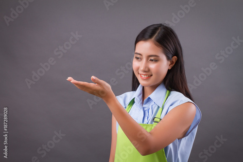 woman worker hand up holding something on blank space