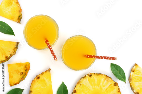 pineapple juice in a glass and pineapple slices isolated on white background with copy space for your text. Top view