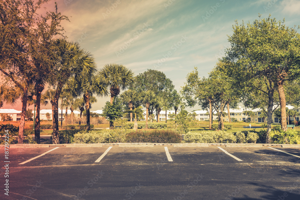 Gated community empty parking lot  in South Florida. Light effect applied