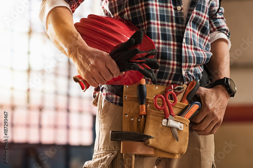 Photography Bricklayer holding construction tools
